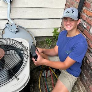 man doing an air conditioner repair near me in bryant arkansas